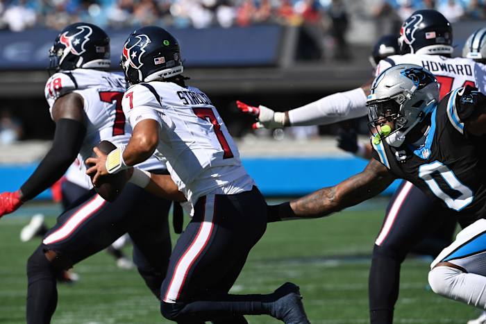Houston Texas QB C.J. Stroud pressured by the Panthers defense